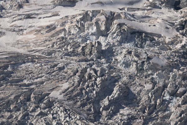 Impressive scene shows lines and textures on residual ice cream in mountains. Daylight emphasises the beauty of this unique, cold landscape. Gorner Glacier, Zermatt, Valais, Alps, Swiss
