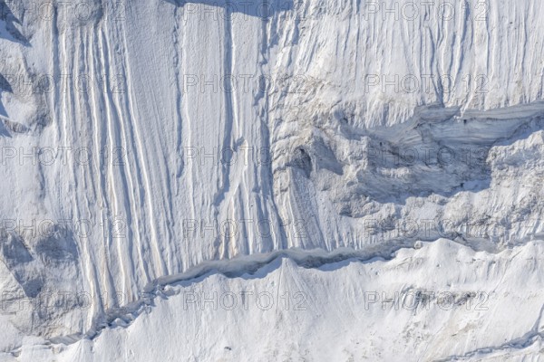 Impressive scene shows lines and textures on residual ice cream in mountains. Daylight emphasises the beauty of this unique, cold landscape. Gorner Glacier, Zermatt, Valais, Alps, Swiss