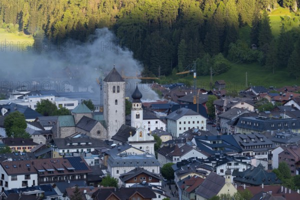 View of a burning building in the town centre of San Candido, San Candido, Val Pusteria, Sesto Dolomites, Dolomites, South Tyrol, Italy