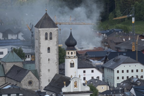 View of a burning building in the town centre of San Candido, San Candido, Val Pusteria, Sesto Dolomites, Dolomites, South Tyrol, Italy