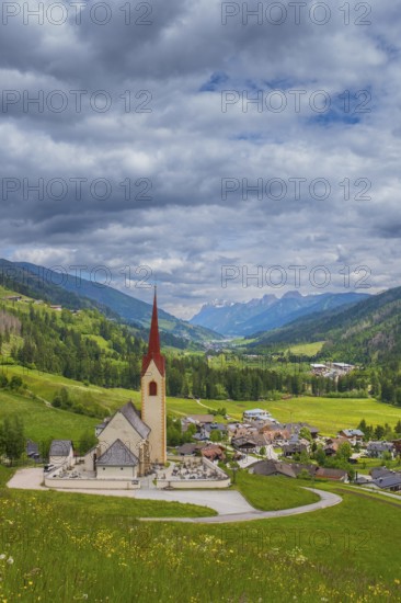 View of the church of Winnebach with the valley behind it, San Candido, Val Pusteria, Dolomites, South Tyrol, Italy