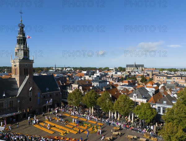 View over town with church and market square, surrounded by historic buildings, aerial view, cheese, cheese market, former town weigh house, Alkmaar, Alkmar, Noord-Holland, North-Holland, Netherlands