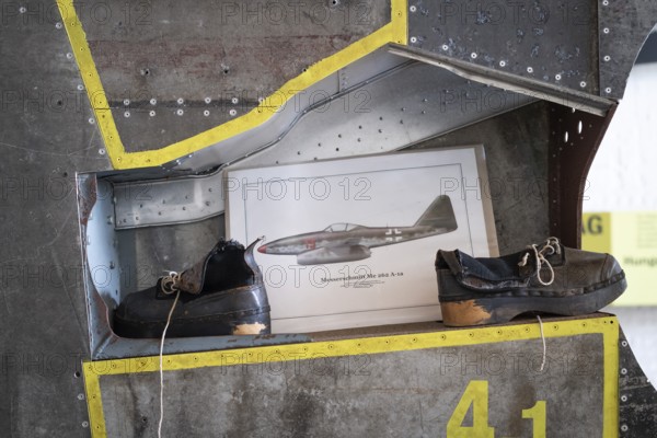 Wooden shoes of a forced labourer standing on an aircraft wing, documentation centre in the old Engelberg tunnel, first motorway tunnel in Germany, 1944 and 1945 production site for wings, Messerschmitt Me 262 fighter aircraft, forced labour, station on the path of remembrance, Leonberg concentration camp memorial, Leonberg, Baden-Württemberg