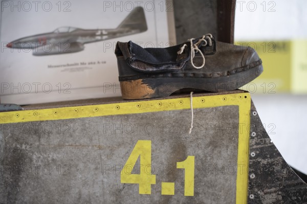 Wooden shoe of a forced labourer stands on aircraft wing, documentation centre in the old Engelberg tunnel, first motorway tunnel in Germany, 1944 and 1945 production site for wings, Messerschmitt Me 262 fighter aircraft, forced labour, station on the path of remembrance, Leonberg concentration camp memorial, Leonberg, Baden-Württemberg