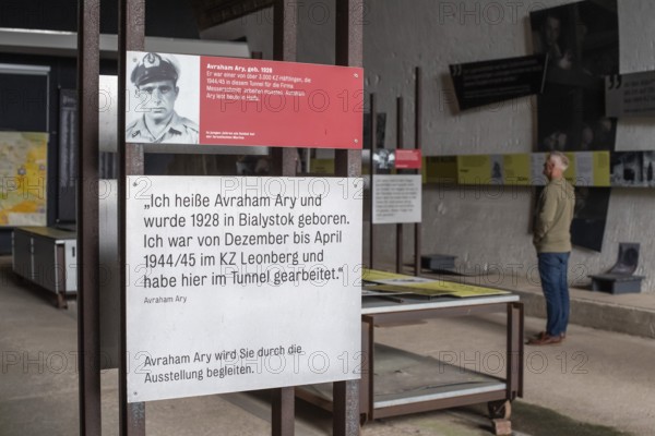Visitor stands in the documentation centre in the old Engelberg tunnel, first motorway tunnel in Germany, 1944 and 1945 production site for wings, Messerschmitt Me 262 fighter aircraft, forced labour, station on the path of remembrance, Leonberg concentration camp memorial, Leonberg, Baden-Württemberg