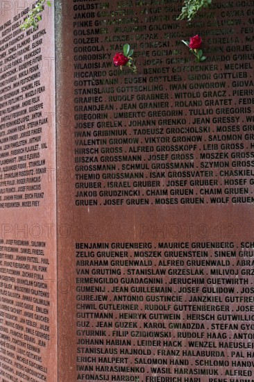 Pinned roses, name wall made of steel plates with a total of 2908 laser-engraved names of former concentration camp prisoners and forced labourers, station on the Path of Remembrance, Leonberg Concentration Camp Memorial, Leonberg, Baden-Württemberg