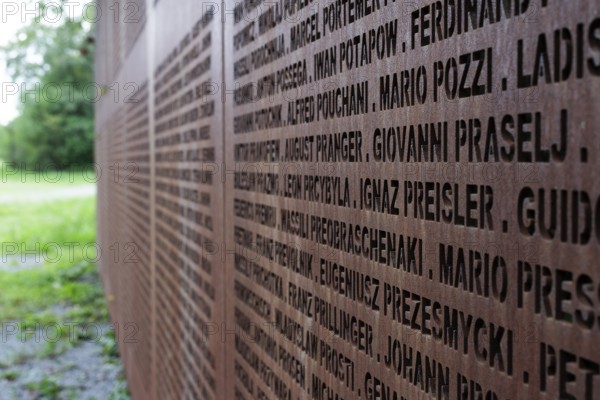 Name wall made of steel plates with a total of 2908 laser-engraved names of former concentration camp prisoners and forced labourers, station on the Path of Remembrance, Leonberg Concentration Camp Memorial, Leonberg, Baden-Württemberg