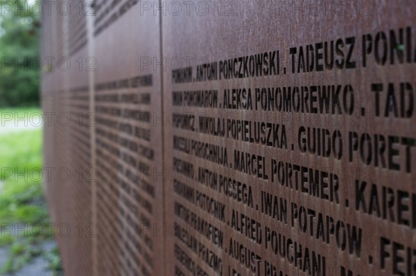 Name wall made of steel plates with a total of 2908 laser-engraved names of former concentration camp prisoners and forced labourers, station on the Path of Remembrance, Leonberg Concentration Camp Memorial, Leonberg, Baden-Württemberg
