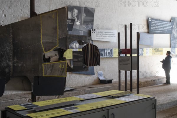 Visitor stands in the documentation centre in the old Engelberg tunnel, first motorway tunnel in Germany, 1944 and 1945 production site for wings, Messerschmitt Me 262 fighter aircraft, forced labour, station on the path of remembrance, Leonberg concentration camp memorial, Leonberg, Baden-Württemberg