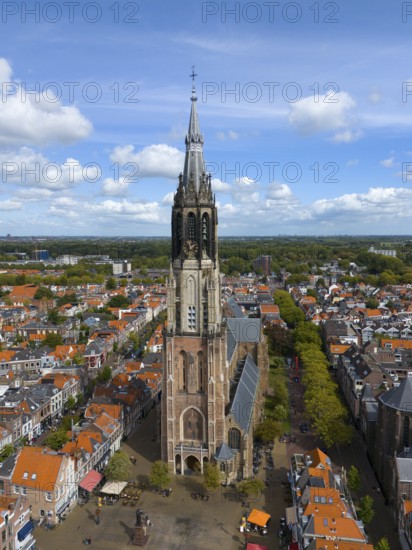 Aerial view of a church tower in the middle of a busy city with red roofs, Aerial view, Nieuwe Kerk, New Church, Market Square, Delft, Province of South Holland, Zuid-Holland, Netherlands