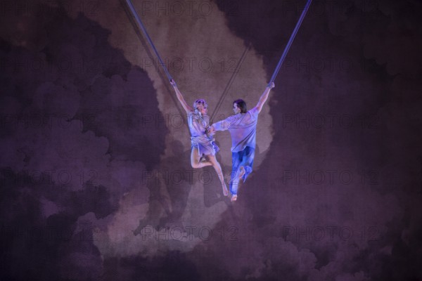 Two artists float at the press screening of Alizé, a joint production by Cirque du Soleil and Live Nation at the Theater am Potsdamer Platz, Berlin, 23/09/2025
