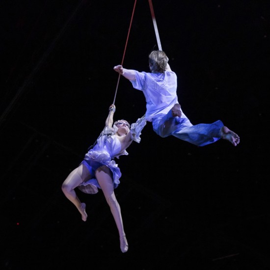 Two artists hover above the audience at the press screening of Alizé, a joint production by Cirque du Soleil and Live Nation at the Theater am Potsdamer Platz, Berlin, 23/09/2025