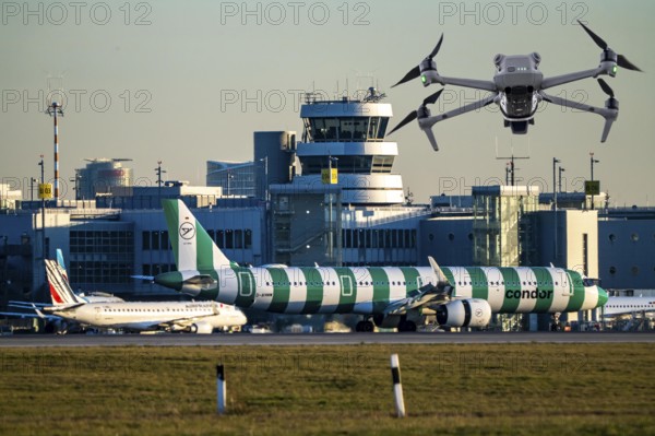 Symbolic image, photomontage, reconnaissance, spying with drones here at an airport, critical infrastructure, spying with camera drones