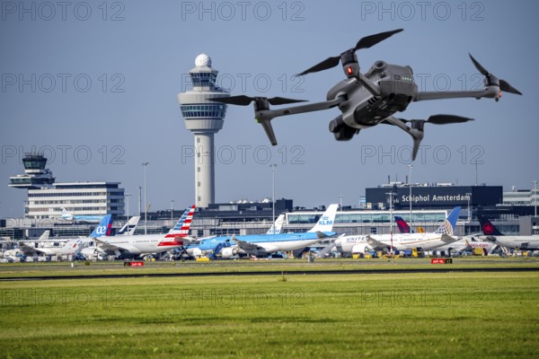 Symbolic image, photomontage, reconnaissance, spying with drones here at an airport, critical infrastructure, spying with camera drones