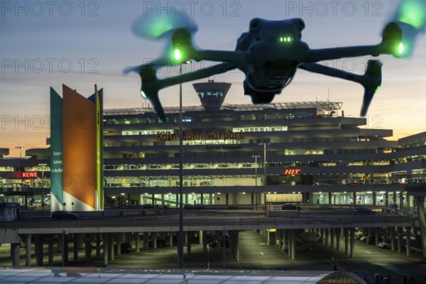 Symbolic image, photomontage, reconnaissance, spying with drones here at an airport, critical infrastructure, spying with camera drones