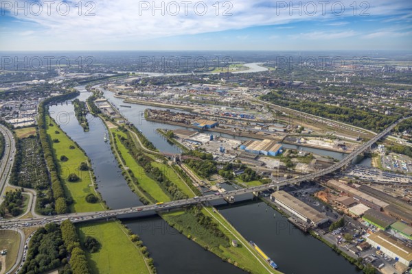 Aerial view, duisport port Duisburg with oil island, coal island and scrap island, motorway A59 with Berlin bridge over the river Ruhr, Duissern, Duisburg, Ruhr area, North Rhine-Westphalia, Germany, bridge, DE, Europe, river, port, port area, harbour area, aerial view, aerial photography, aerial photography, overview, bird's-eye view, duisport, overview