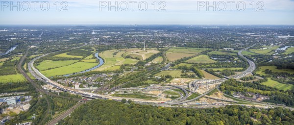 Aerial photo, panoramic photo of the Kaiserberg motorway junction with construction site, A40 and A3 motorways, behind Styrumer Ruhrbogen energy park with wind turbine, Duissern, Duisburg, Ruhr area, North Rhine-Westphalia, Germany, motorway, construction work, construction area, construction site, building plots, construction project, construction site, DE, Europe, major construction site, aerial photo, aerial photography, aerial photography, new construction, road traffic, overview, bird's-eye view, overview