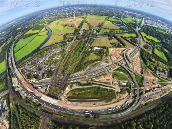 Aerial photo, Kaiserberg motorway junction with construction site, behind Styrumer Ruhrbogen energy park, earth globe, fisheye image, 360 degree image, tiny world, little planet, fisheye image, Duissern, Duisburg, Ruhr area, North Rhine-Westphalia, Germany, motorway, construction work, construction area, construction site, building plots, construction, construction project, construction site, DE, Europe, fisheye lens, fisheye lens, large construction site, Little Planet, aerial view, aerial photography, aerial photography, new construction, road traffic, super wide angle lens, Tiny World, overview, bird's eye view, globe, birds-eyes view, fisheye lens, insta360 camera, overview