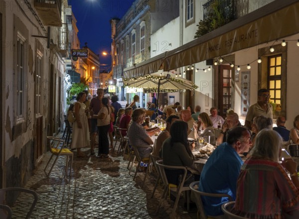 Gastronomy, restaurants in Tavira, old town, partly streets, alleys are closed and serve as terraces for the restaurants, in the east of the Algarve, Portugal