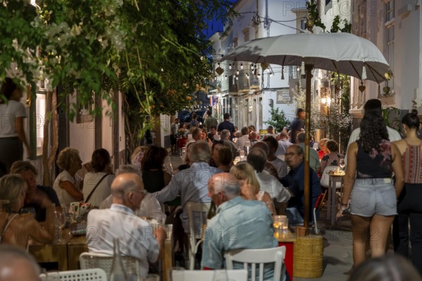 Gastronomy, restaurants in Tavira, old town, partly streets, alleys are closed and serve as terraces for the restaurants, in the east of the Algarve, Portugal