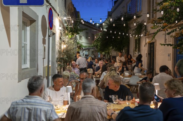 Gastronomy, restaurants in Tavira, old town, partly streets, alleys are closed and serve as terraces for the restaurants, in the east of the Algarve, Portugal