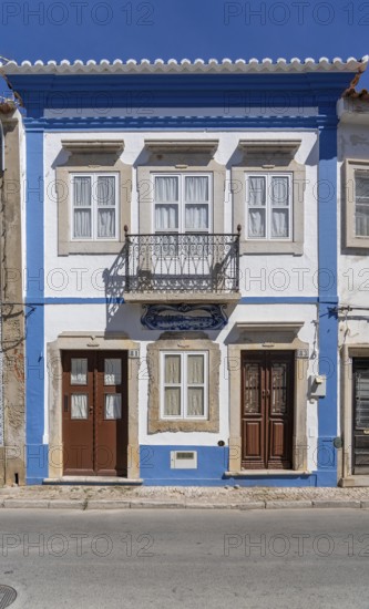Facade of buildings decorated with tiles, azulejos, coloured tiles on facades, in Tavira, old town, in the east of the Algarve, Portugal