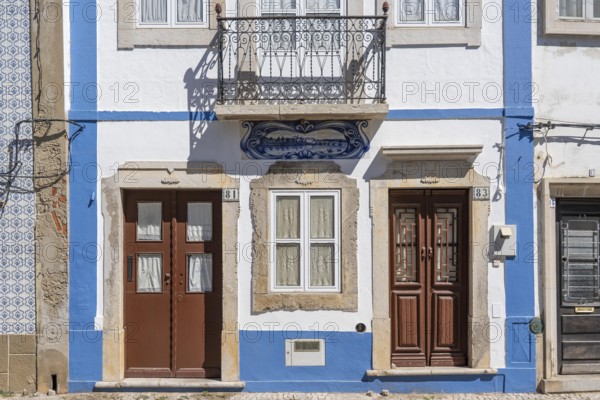Facade of buildings decorated with tiles, azulejos, coloured tiles on facades, in Tavira, old town, in the east of the Algarve, Portugal
