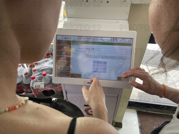 Paying with e-cash at the supermarket, San Carlos, Negros Occidental, Philippines