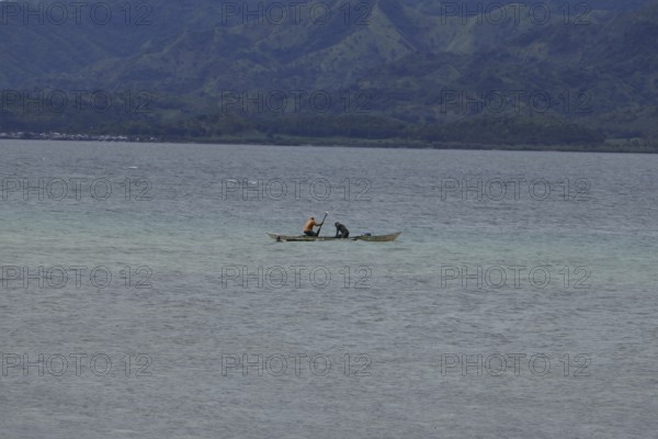 Two fishermen fishing off the coast, Negros Occidental, Philippines