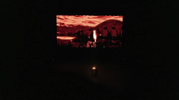 Dancers from Fire of Anatolia perform a choreography in red costumes with a historic stone wall projected on stage. The troupe combines Anatolian folk traditions with modern stage techniques and has performed in more than 85 countries, Gaziantep, Gaziantep, Türkiye