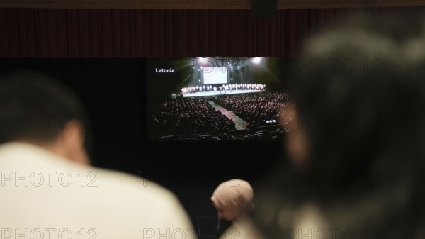 Audience members gather inside the theater before the start of the Fire of Anatolia show in Gaziantep. The Turkish dance ensemble, founded by Mustafa Erdogan, is one of the largest in the world with more than 120 dancers, Gaziantep, Gaziantep, Türkiye