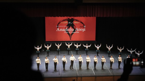 Members of Fire of Anatolia, also known as Anadolu Atesi, bow to the audience after their performance at Gaziantep University. The troupe enjoys worldwide fame and holds Guinness World Records for its achievements, Gaziantep, Gaziantep, Türkiye