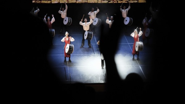 Dozens of members of Fire of Anatolia perform a drumming sequence during a cultural festival at Gaziantep University. The troupe is one of the largest dance ensembles in the world and includes 120 members, Gaziantep, Gaziantep, Türkiye