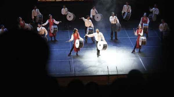 Dozens of members of Fire of Anatolia perform a drumming sequence during a cultural festival at Gaziantep University. The troupe is one of the largest dance ensembles in the world and includes 120 members, Gaziantep, Gaziantep, Türkiye