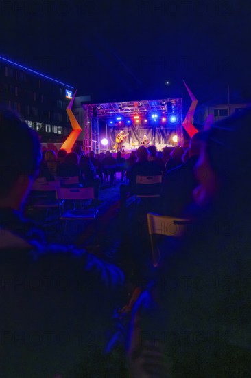 A night-time open-air concert with bright lights and a lively atmosphere, Sindelfingen, Böblingen district, Germany