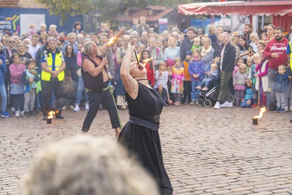 Street performance with fire breathers, surrounded by a curious crowd, Sindelfingen, Böblingen district, Germany