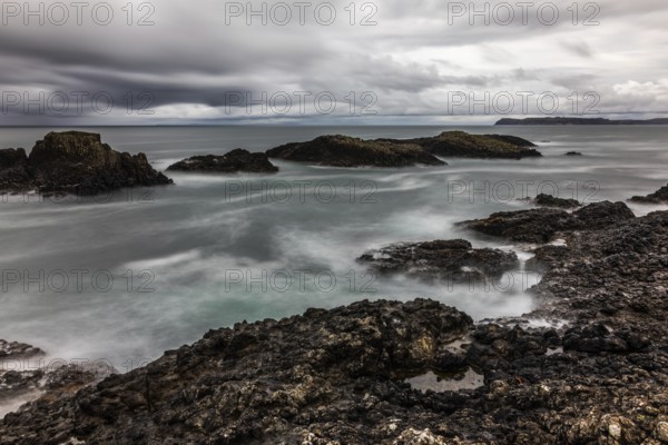Rocky coast, offshore islands, Ballintoy Harbour, Causeway Coastal Route, Antrim, Northern Ireland, Great Britain