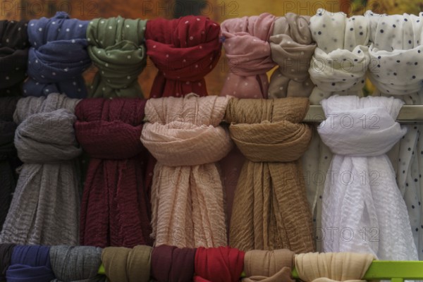 Warm and stylish scarves hanging, perfect for adding a touch of color and comfort to any outfit in ronda, malaga, spain