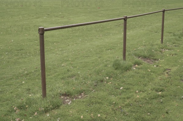 Borken, NRW, Germany, Metal railing boundary defining a sports field or park area