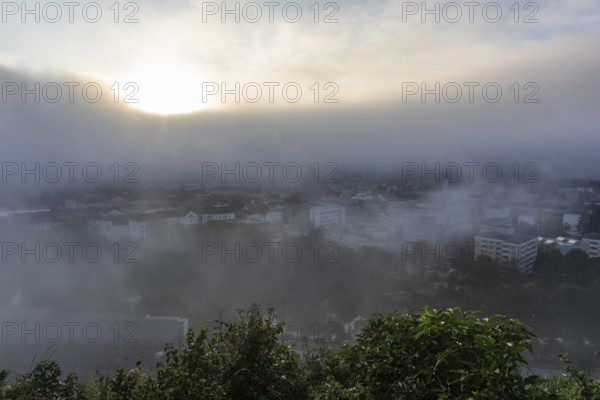 The city of Leoben in the early morning fog, Leoben, Styria, Austria