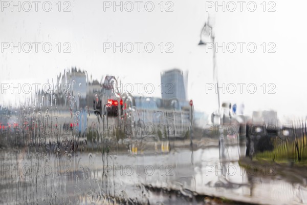 Raindrops on windscreen, red light from a traffic light, Dublin, Ireland