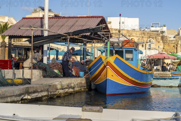 Beautiful view of Marsaxlokk, traditional maltese fisherman village on south of the island, Malta