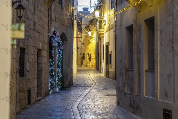 Charming illuminated medieval streets of Rabat Mdina in the evening Malta