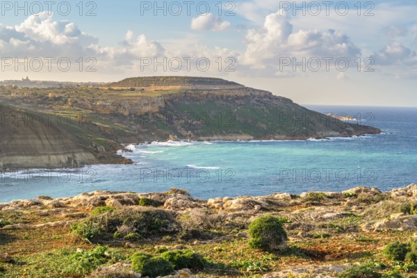 Beautiful view of Gozo coast seen from Ghar Mixta Cave, Malta