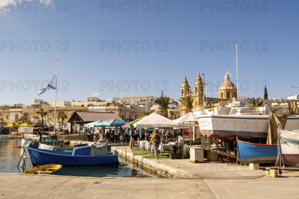 Beautiful view of Marsaxlokk, traditional maltese fisherman village on south of the island, Malta