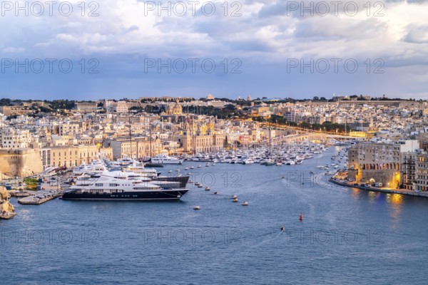 Beautiful evening view of illuminated Valletta, Birgu with Saint Angelo Fortress, capital city of Malta