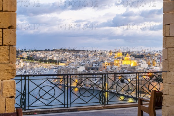 Beautiful evening view of illuminated Valletta, Birgu with Saint Angelo Fortress, capital city of Malta