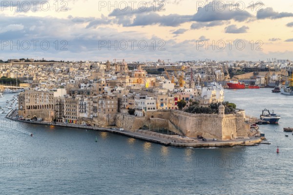 Beautiful sunset view of Valletta city with Saint Angelo Fortress, capital city of Malta