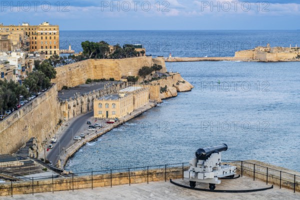 Seafront view of historic La Valletta with Lower Barrakka gardens, taken from Upper Barrakka garden, capital city, Malta