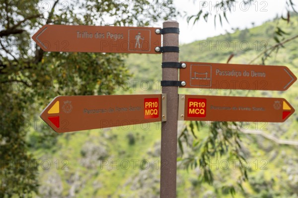 Brown information sign indicating different trails in Monchique area, Algarve, Portugal